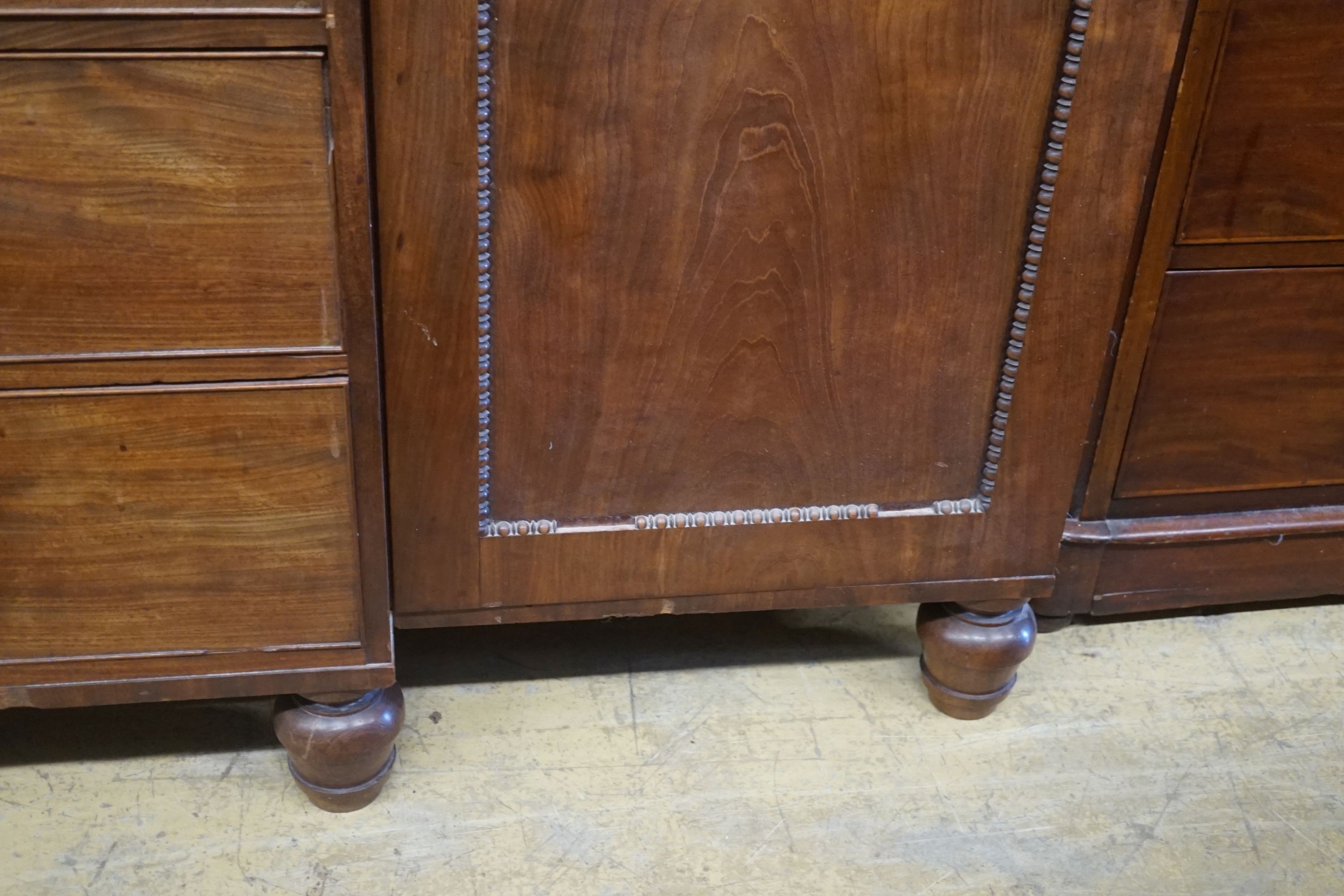 A George IV flamed mahogany break-front wardrobe, length 244cm, depth 60cm, height 195cm